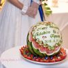 オーダーフルーツカービング　ウェディングのスイカ入刀　新郎新婦のお名前と結婚記念日も文字をお入れしたスイカカービング。ハートと薔薇も多い、1番人気のデザイン。